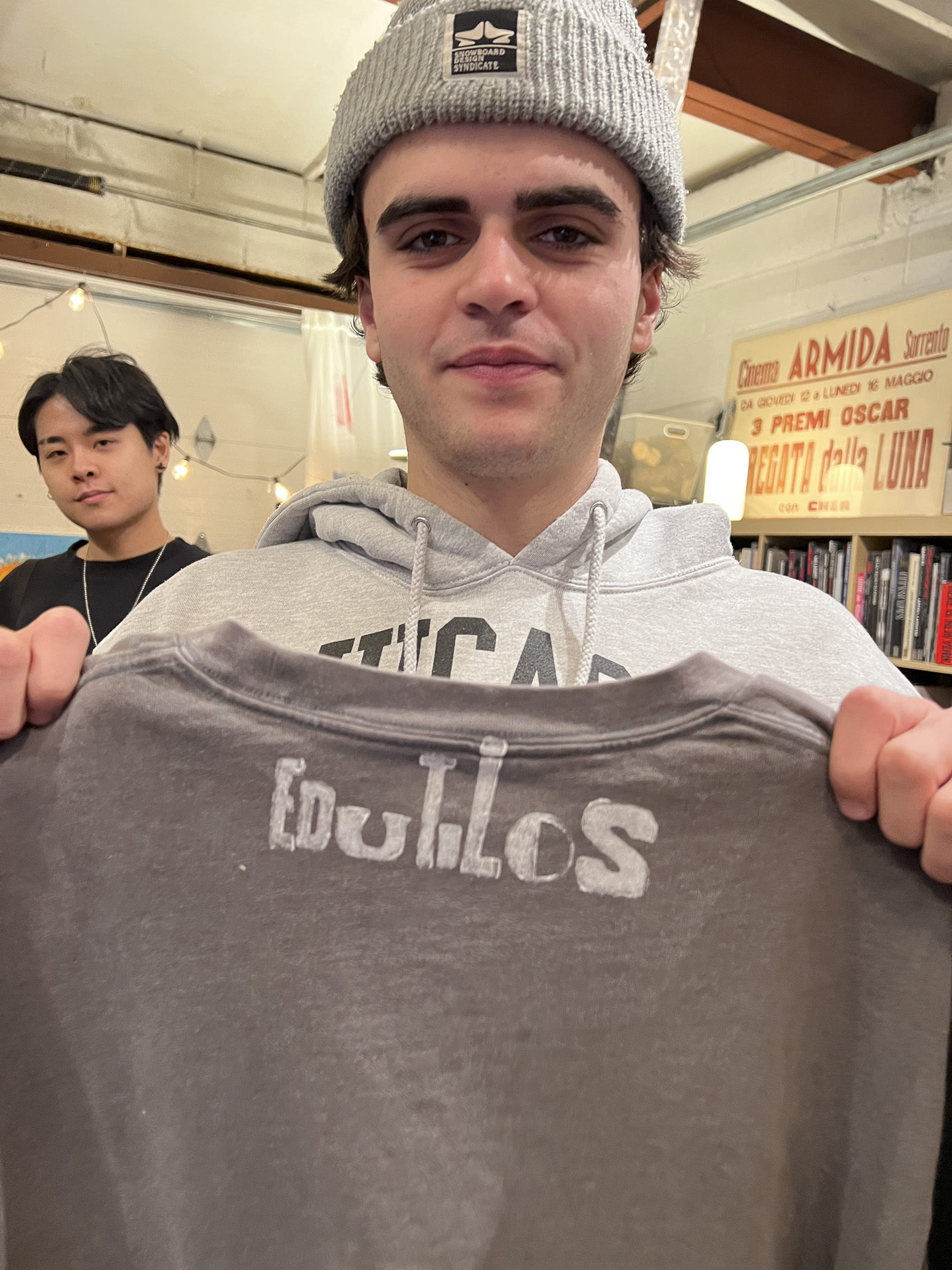 Tisch student holding a print made with hand-set type